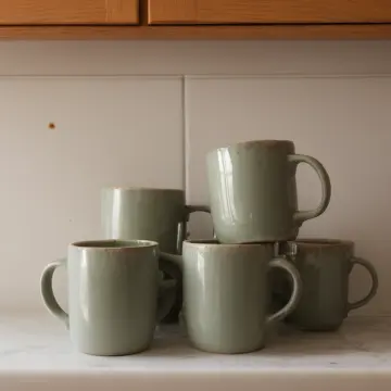 AI-generated art thumbnail for: Ceramic mugs stack near sink