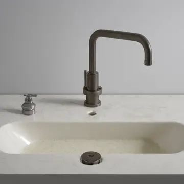 Dishes and cleaning supplies in Utility sink area. Routine cleanup near closing time. Wet ceramic basin