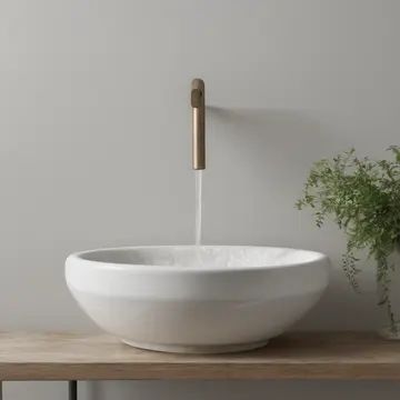 A porcelain basin and copper faucet in Small utility sink area. The sink is filled with soapy residue, and a small potted herb sits on the edge. Soap suds clinging to porcelain...