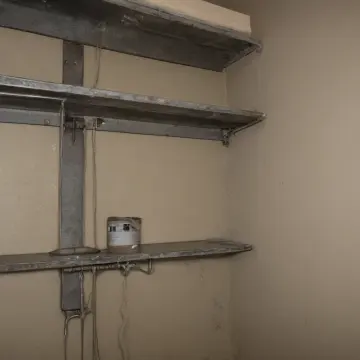 AI-generated art thumbnail for: Spools on the Utility Shelf