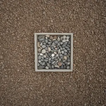 Aquarium gravel and feeder roots in Utility closet corner. The gravel bed rearranges itself into precise, parallel rows when ambient noise increases. Small plastic feeder roots