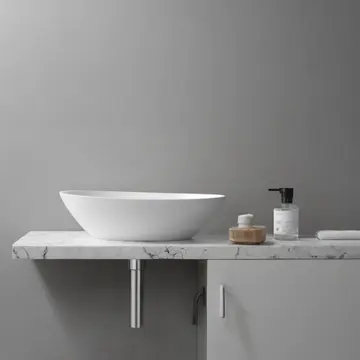 Toothbrush holder in Bathroom counter. A morning routine is interrupted by an unmovable object. Slight water stain on tile