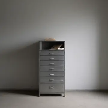 Card index card cabinet in Utility server room corner. A stack of forms is slowly tightening around an unseen central point. Dust film on the metal drawers