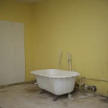 Worn rubber gloves in Utility sink room. Cleaning accumulated sediment from the basin. Grime streaks on porcelain