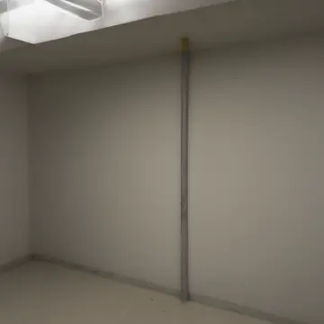 Spools of colored electrical tape and coiled cords in Utility room adjacent to an office corridor. A meticulous arrangement of supplies waiting for inventory check. Dust motes...