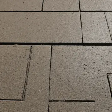 A set of ceramic transit tokens in Bus station waiting bench. The tokens are being meticulously sorted by proximity to the edge. Dust film on the bench slats